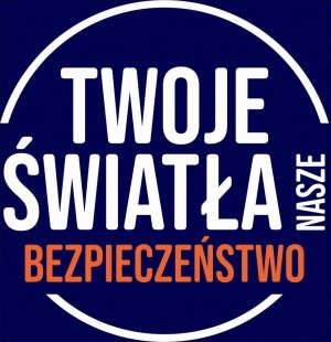 grafika-biały napis ;Twoje światła; i biały napis ;Nasze; oraz pomarańczowy Bezpieczeństwo, na granatowym tle