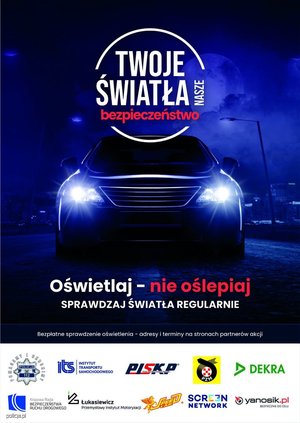 plakat akcji- widoczne auto z włączonymi światłami, napis &quot;Twoje światła - Nasze bezpieczeństwo&quot;