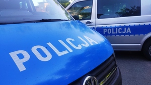 radiowozy policyjne, dzień ,napis Policja